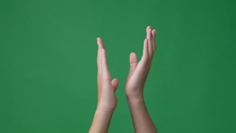 clapping hands over green screen