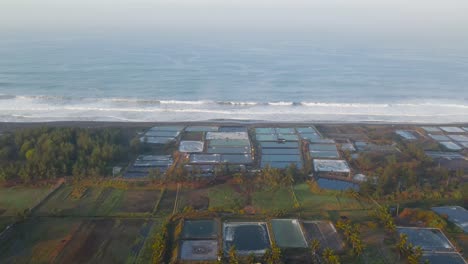 Sea-salt-harvesting-ponds,aerial-sideways-pan