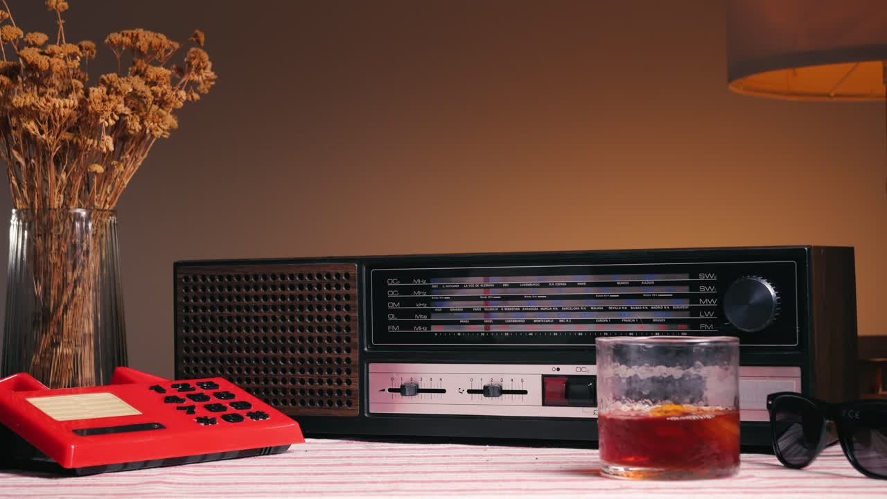 Vintage Retro Scene with Radio, Phone, Drink and Sunglasses