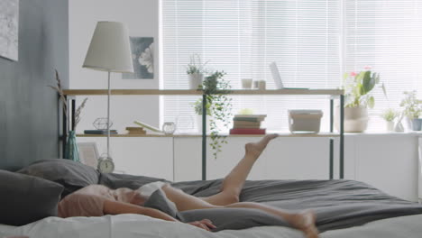 woman jumping and sleeping in bedroom