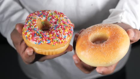 two delicious donuts: sprinkled and plain