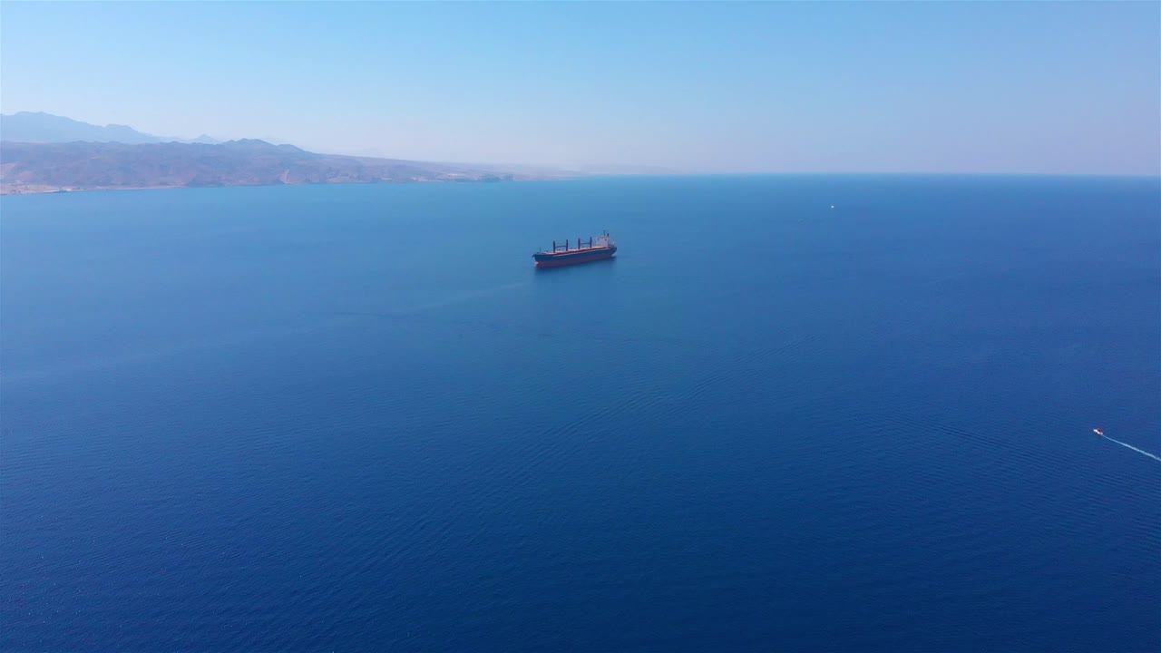 Aerial View of a Large Cargo Ship Sailing in the Open Sea