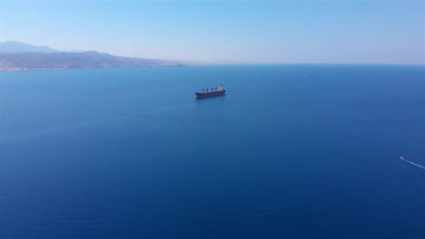 aerial view of a large cargo ship sailing in the open sea