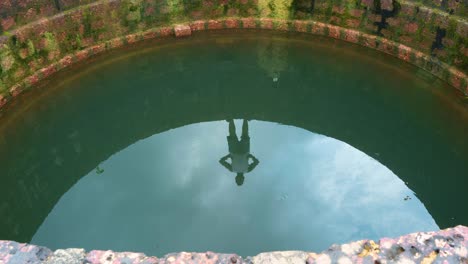 well-timelapse-man-standing-over-well-moving-clouds