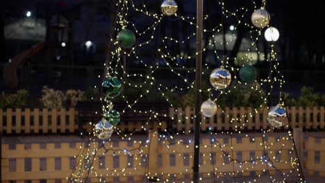 christmas tree with lights and ornaments at night