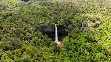 aerial view of bridal veil falls with green forest in waikato, new zealand