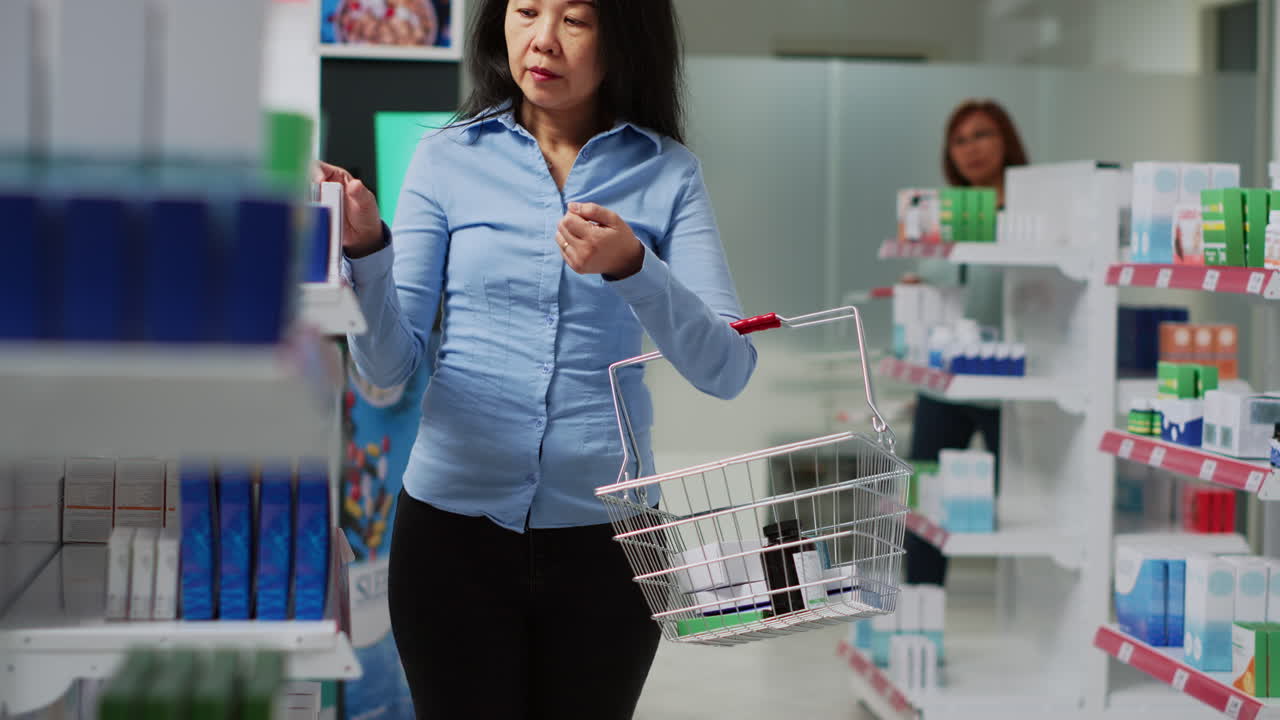 Asian woman shopping for medicine in pharmacy