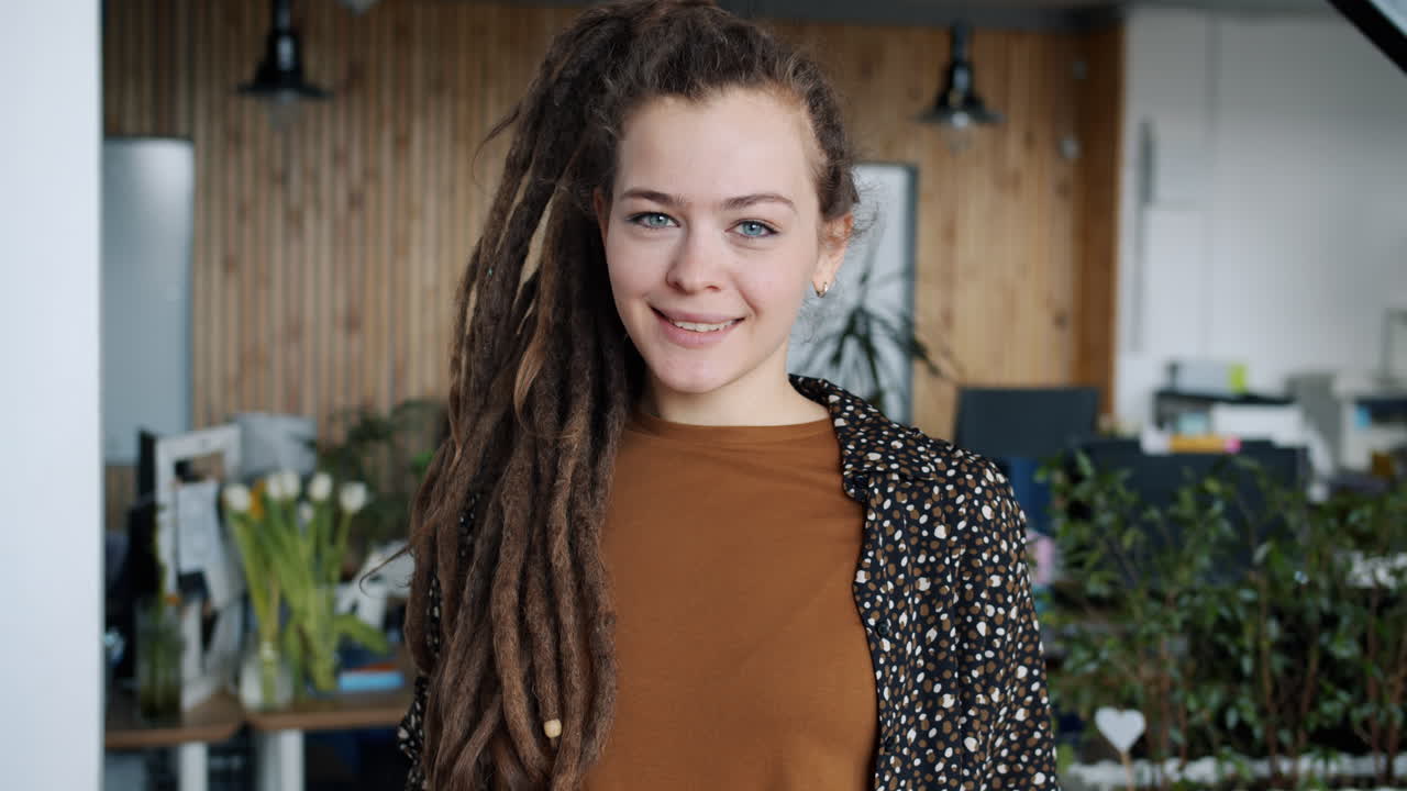 Woman with Dreadlocks in Modern Office