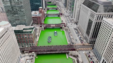 aerial view overlooking ferries on the dyed chicago river on st