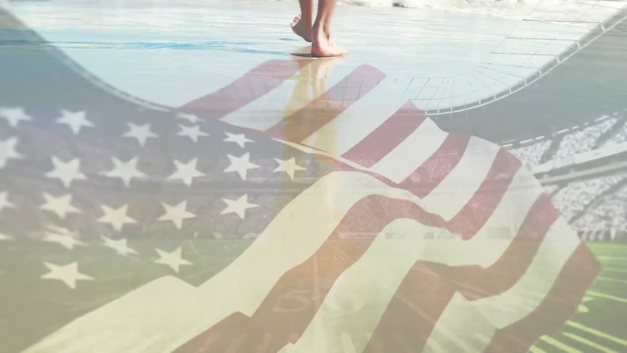 animación de la bandera de los estados unidos de américa ondeando, sobre los pies de un hombre caminando por la playa hacia el mar