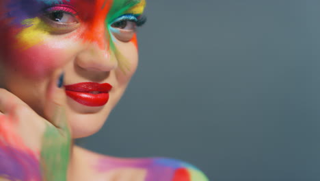 Face,-woman-and-rainbow-paint-makeup