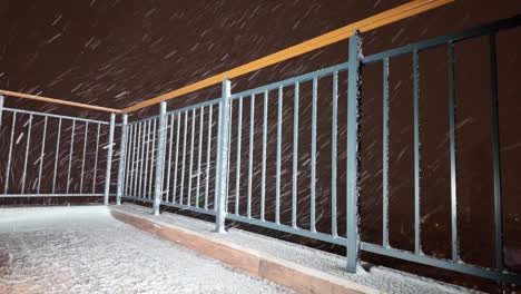 snowy balcony at night