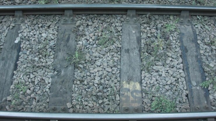 Old train track showing different textures and levels of usage.