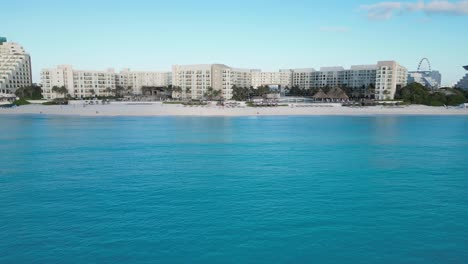 stunning aerial view of cancun beach with resorts, blue waters, and bright sky, playa delfines