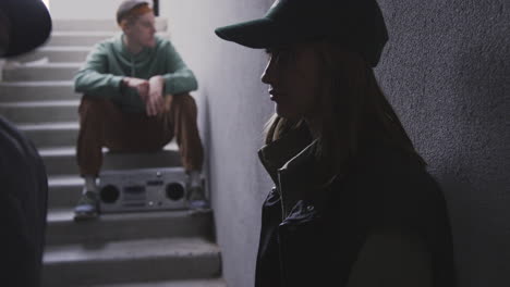 young woman with black cap indoors