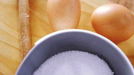 various ingredients and brown egg on wooden table 4k