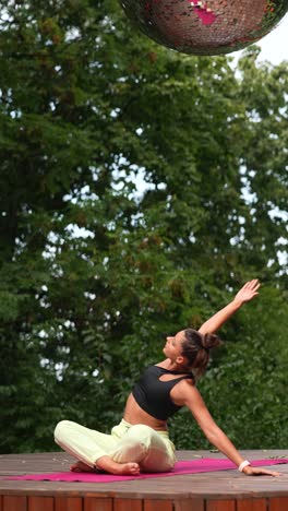 woman practicing yoga outdoors