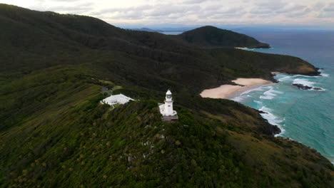 Cinematic-rotating-drone-shot-of-sunrise-at-Smoky-Cape-Lighthouse-near-South-West-Rocks,-Australia