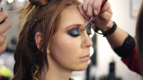 Make-Up-Artist-Applies-Some-Colour-Shadows-On-Model's-Eyelids