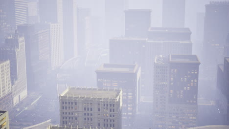 city skyline shrouded in fog during early morning hours