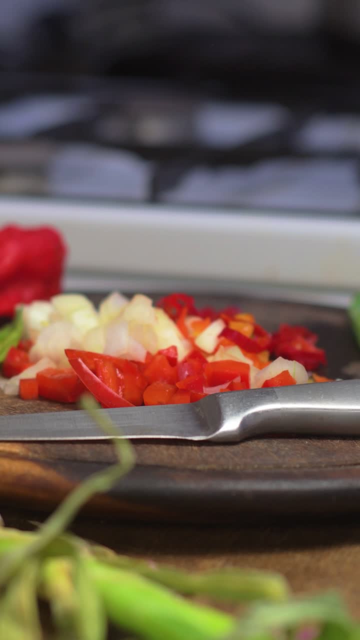 Chopping ajie cebolla and cebollin in a lively kitchen setting. Bright colors and fresh ingredients create an inviting atmosphere, perfect for showcasing Latin American culinary traditions