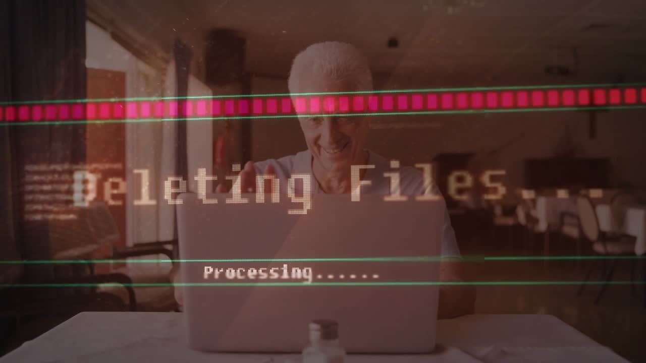 Senior man pressing key on laptop in church hall and watching glitchy IT file deletion progress