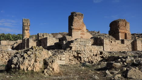 sunny day over ancient roman ruins at dougga with clear blue sky