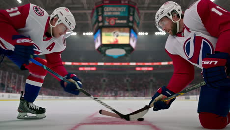two hockey players face off on the ice rink