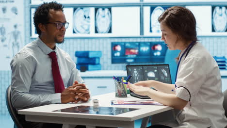 female doctor and patient engage in a medical consultation with diagnostic tools