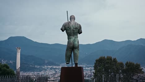 sentinel statue over pompeii ruins - dedalo by igor mitoraj