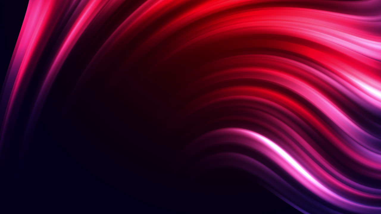 Colorful abstract swirling red flow. Curved glowing lines on a dark blurred background. Looped animation.