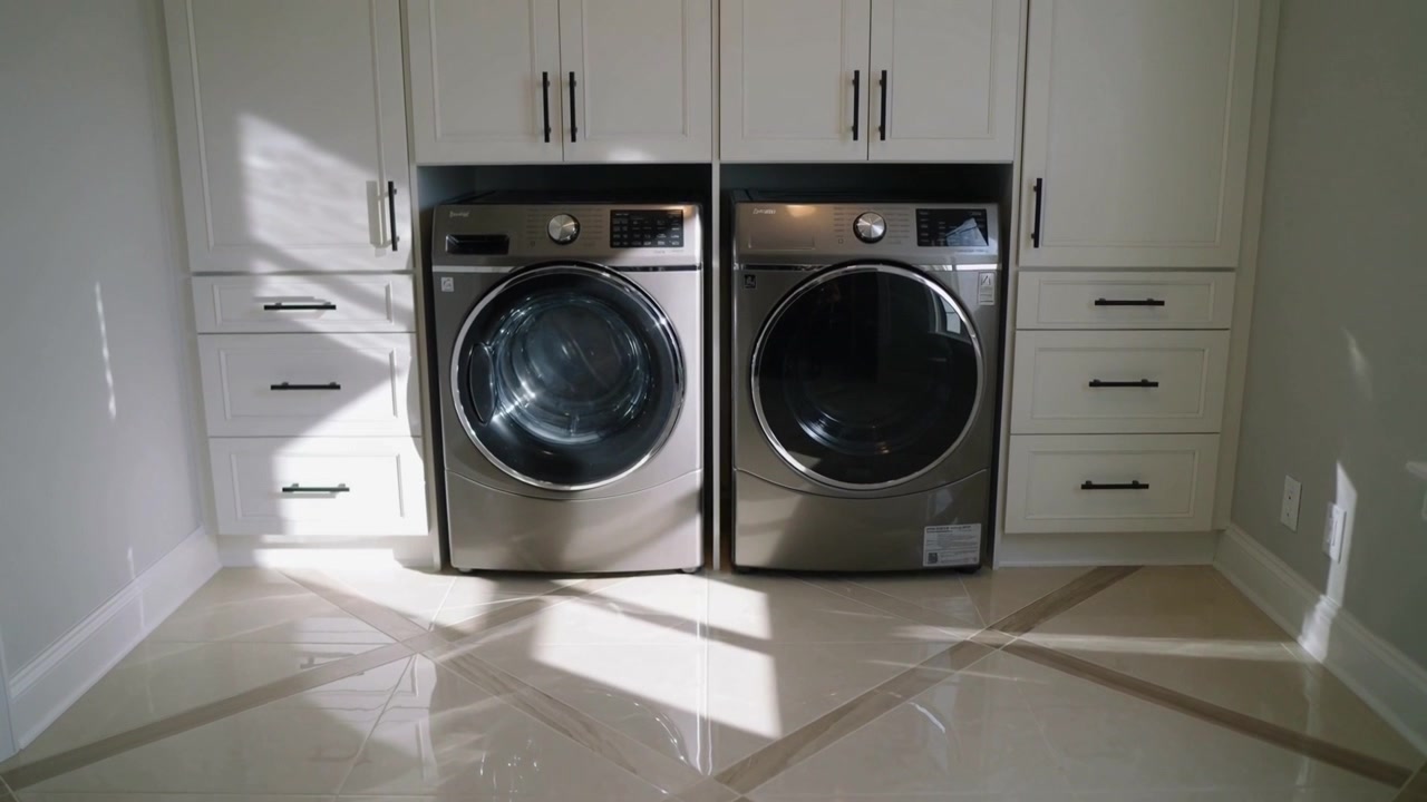 Washer and dryer sitting in home laundry while sunlight shifting and camera tightening, cabinets