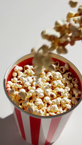 popcorn in a striped bowl