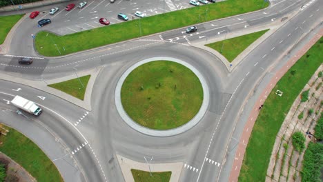 busy urban traffic. aerial top view traffic on circle road in city at day. 4k stock footage.