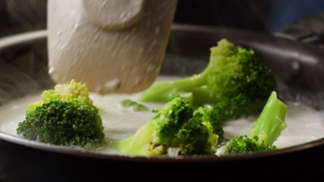 cooking broccoli in a creamy sauce