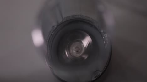 male hand turning on blender, top view, 4k