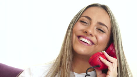 happy smiling woman talking over home phone, headset of vintage rotary telephone, close up