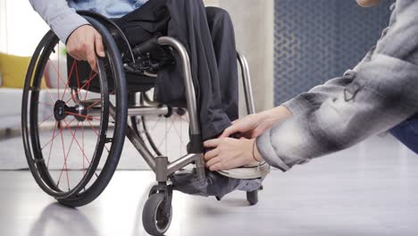 Girlfriend-helping-her-paraplegic-boyfriend.-Care-and-disability-concept.