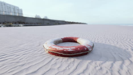 lifebuoy on the city beach at sunset