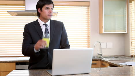 a man smiling after drinking an orange juice