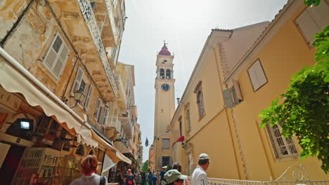 historic bell tower and shops in a narrow old town street