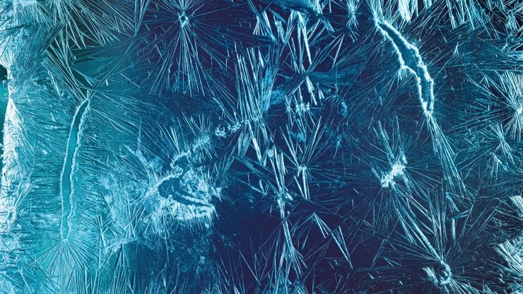 Winter background - Frost pattern on the glass.