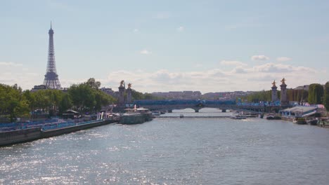 wide scenic shot of river seine during the 2024 summer olympics with the eiffel tower