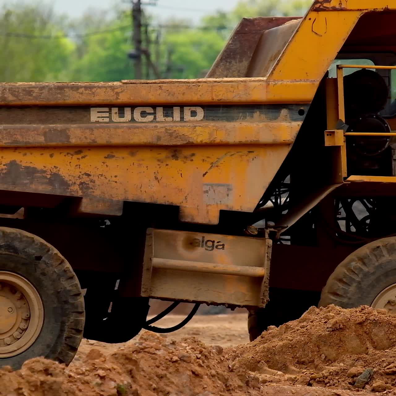 Heavy yellow dumper trucks