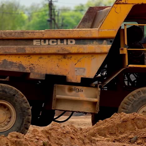 heavy yellow dumper trucks
