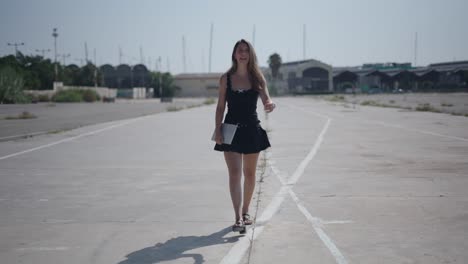 woman walking on a road