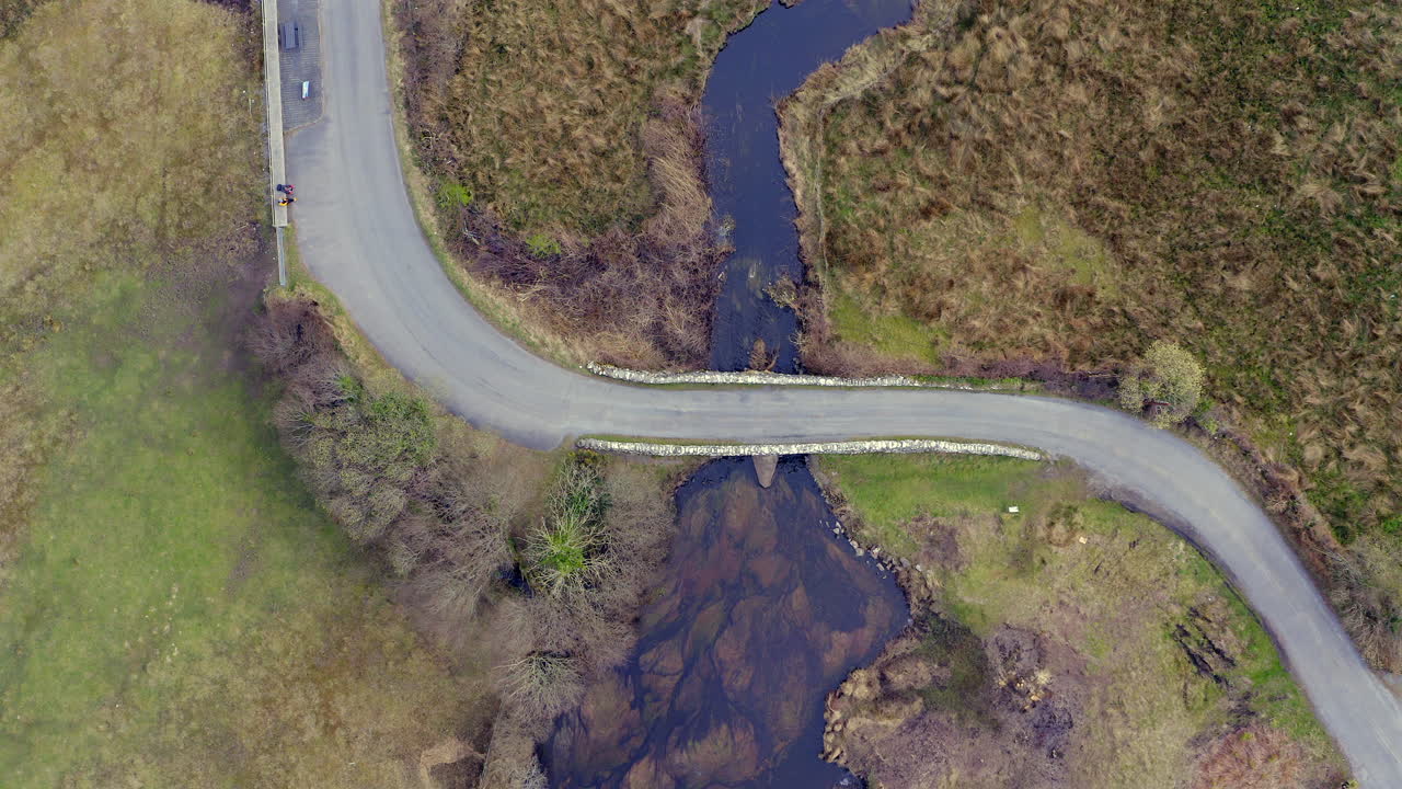 Static aerial establishing shot directly above the iconic Quiet Man Bridge, Galway