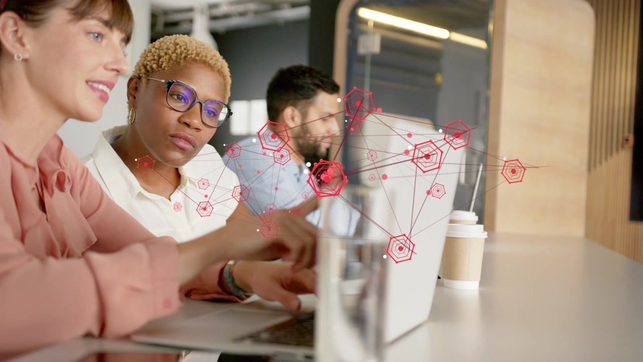 Business team typing, left woman pointing at screen causing red network expanding showing data