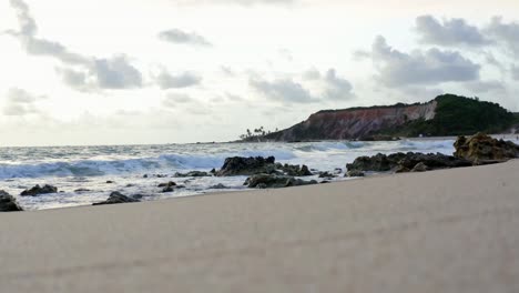 Beautiful-shot-from-the-ground-of-the-large-tropical-colorful-cliffs-on-the-exotic-beach-of-Tabatinga-in-Northern-Brazil-near-Joao-Pessoa-on-a-warm-summer-day