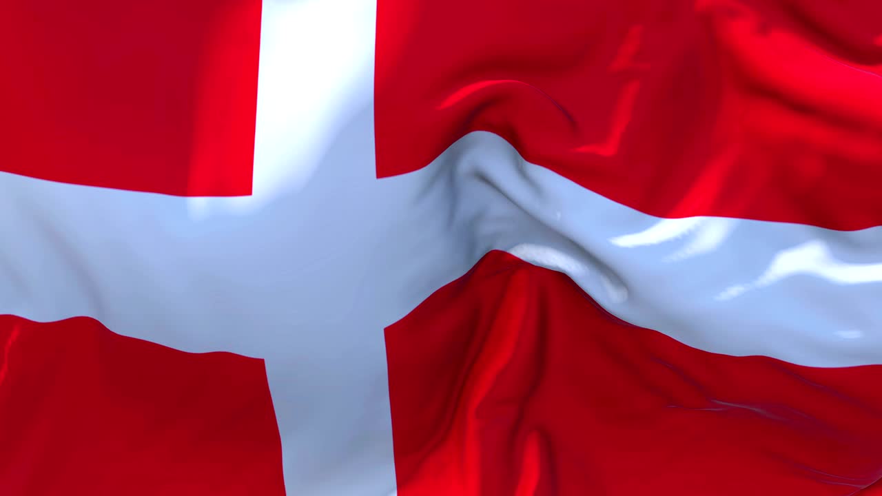 Dannebrog vajende i vinden i slowmotion-animation. 4K realistisk flag med stoftekstur, der blæser jævnt på en blæsende dag. Kontinuerlig sømløs loop-baggrund.